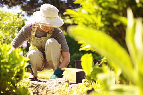 Operatives assessing a garden, noting hazards during site visit
